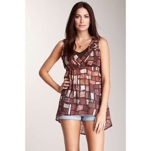 Sleeveless empire waist rosette shoulder high low